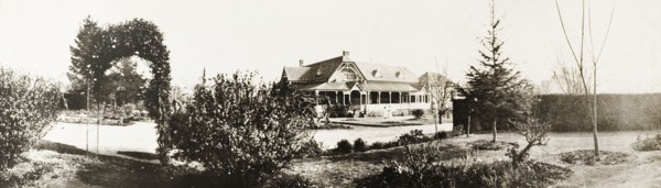 Government House, Pretoria. Exterior view across the formal gardens to the colonial-style