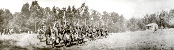 Swazi warriors perform a war dance. Swazi warriors perform a war dance for visiting British