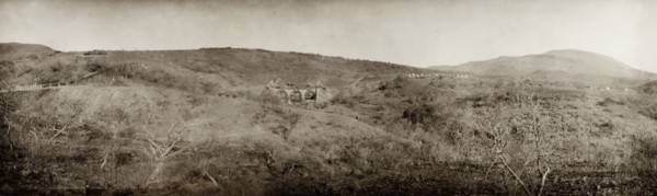 Construction of a bridge, South Africa. Three horsemen ride down to a ford to view the construction