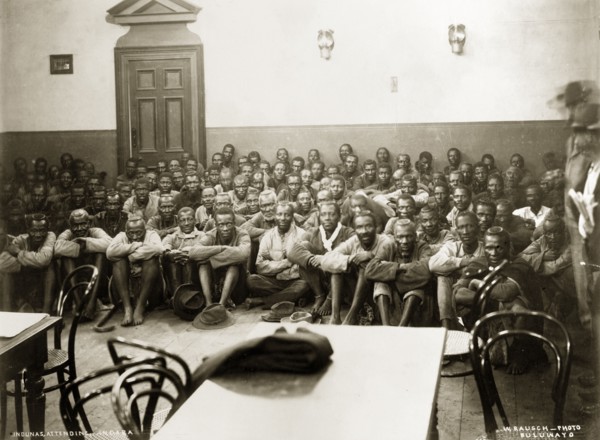 A Matabele indaba with Captain Lawley. Matabele indunas (chiefs) sit on the floor of the Stock