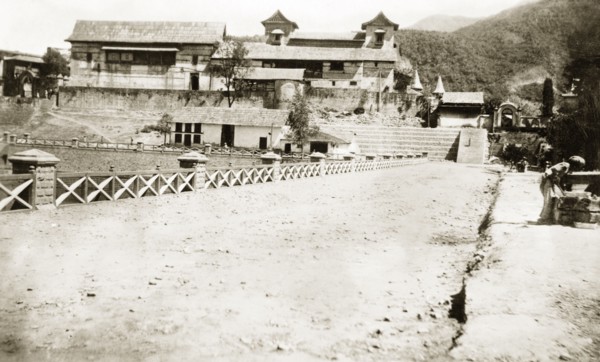 Palatial residence in northern India. View down a driveway, looking towards the rear of a large,