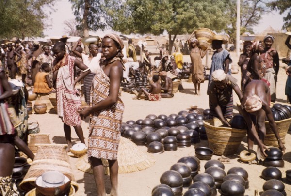 Pot section at Bolgatanga market. Traders and customers bustle about amidst the pot section at