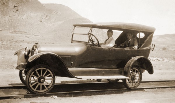 A car modified for rail, Peru. Jack Cooper drives a motor car that has been modified to travel on
