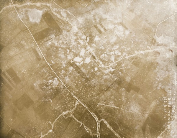 Fields riddled with trenches and bomb craters. One of a series of British aerial reconnaissance