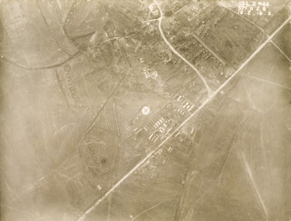 A military camp at a bomb-damaged village. One of a series of British aerial reconnaissance