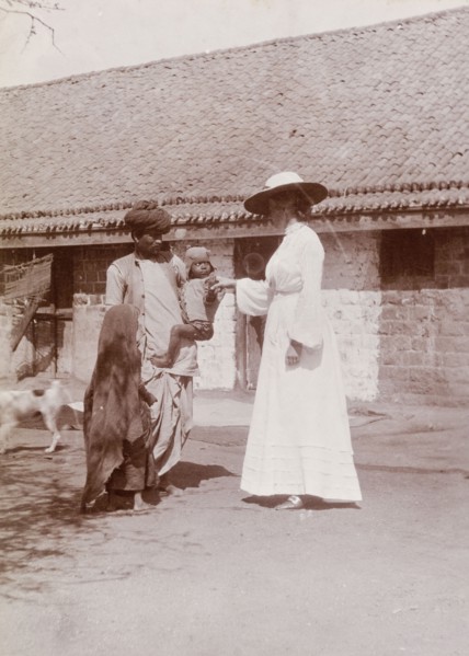 Phyllis Lawrence greets a farm worker's family. Phyllis Louise Lawrence, the first wife of Sir