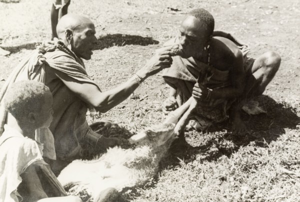 Kikuyu purification ceremony. A Kikuyu witch doctor performs a traditional purification ceremony to