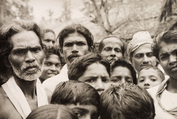 A crowd of Ceylonian men. A crowd of men and boys stare solemnly into the camera. Ceylon (Sri