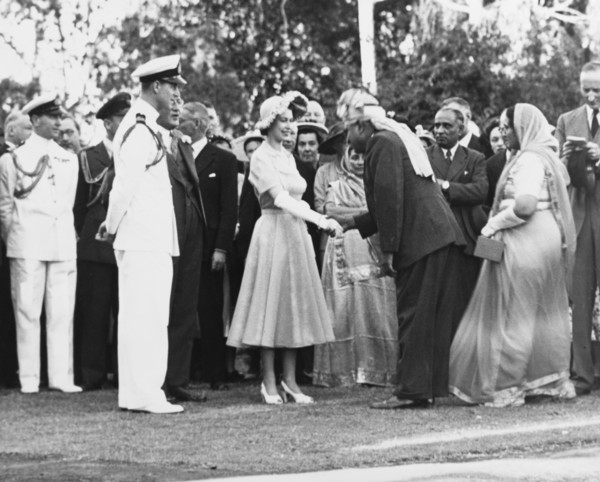 Princess Elizabeth greets Asian dignitaries. Princess Elizabeth and the Duke of Edinburgh greet