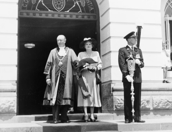 The Mayor and Mayoress of Nairobi. The Mayor of Nairobi stands on the steps of City Hall with his