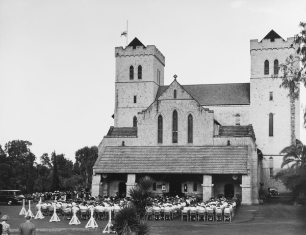 Memorial service for King George VI, Nairobi. A congregation of mourners sit on chairs with their