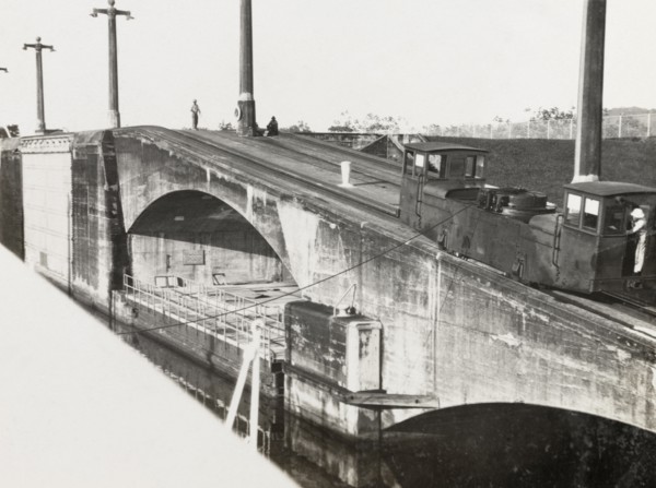 Mole on Panama Canal. A railcar runs along the top of a stone mole by the Panama Canal. Panama,