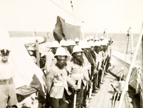 King Neptune's bodyguard. Crew members aboard the HMS Dauntless line up on deck dressed in fake
