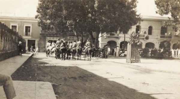 Rurales in Santo Domingo. A band of 'rurales' (Mexican rural guards) ride on horseback through a