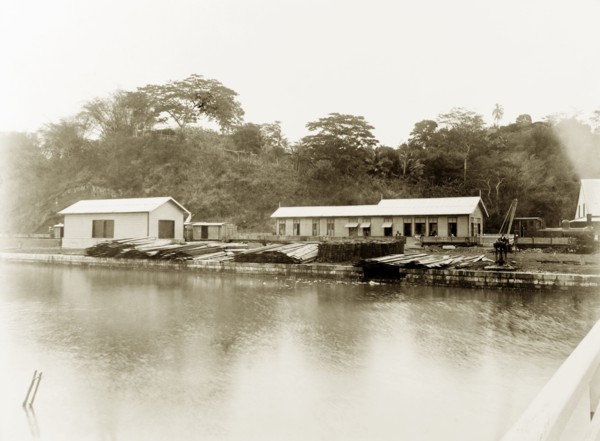 San Fernando railway station, Trinidad. View across a river to a steam locomotive pulled in at San