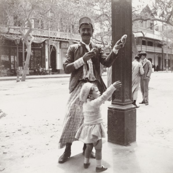 Gully gully man' performing a trick. An Egyptian 'gully gully man' (travelling magician) performs a