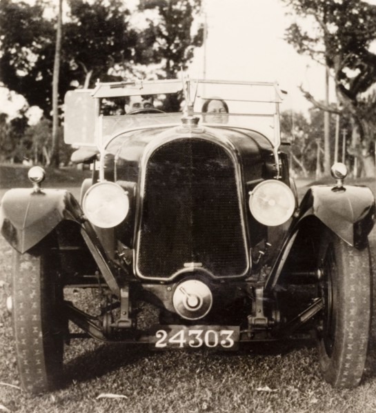 Posing in a Avion Voisin car, Calcutta. British colonist Noel Stokes sits in his Avion Voisin car