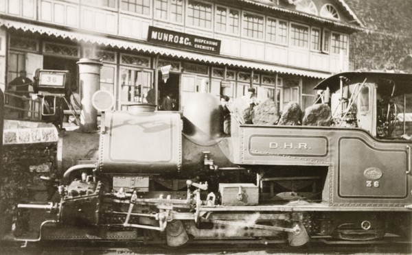 Steam train at Darjeeling station. A steam locomotive stops at Darjeeling station on the Darjeeling