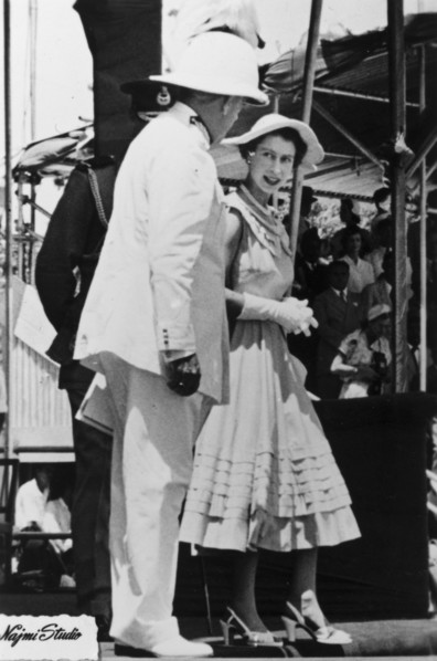 Queen Elizabeth II in Aden. Queen Elizabeth II chats with a uniformed dignitary, possibly the