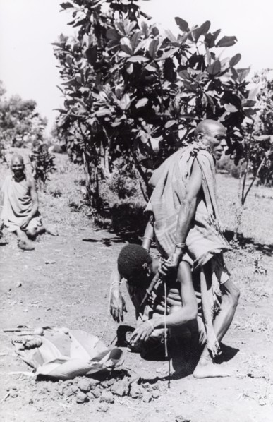 Kikuyu purification ceremony. A Kikuyu witch doctor performs a traditional purification ceremony to