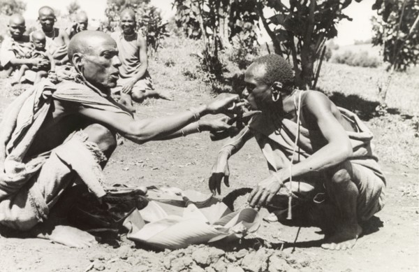 Kikuyu purification ceremony. A Kikuyu witch doctor performs a traditional purification ceremony to