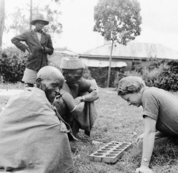 Elspeth Huxley plays a mancala game. Elspeth Huxley contemplates her next move as she plays a