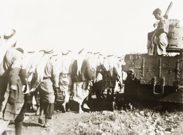 Marching Palestinian Arabs to a detention centre. British soldiers march a group of Palestinian