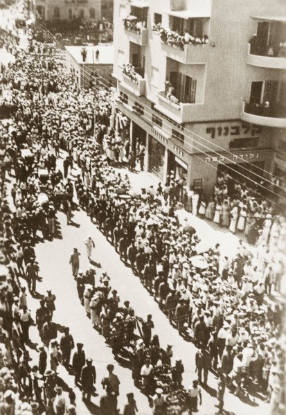 Funeral procession in Tel Aviv. A military escort accompanies a funeral procession during the Great