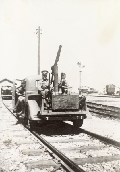 Rail trolley from Israel to Egypt. British soldiers armed with light mortar ride a rail trolley