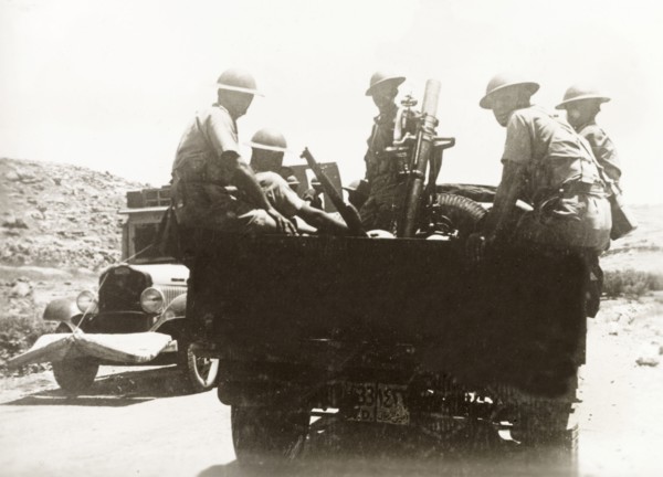 British soldiers with light mortar, Palestine. British soldiers and light mortar are transported to