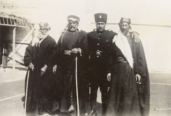 Palestinian police officer with 'mukhtars'. An officer of the Palestine Police Force poses for a