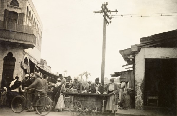 Marketplace in Jaffa. Street traders sell goods from a wheeled cart at a busy marketplace in Jaffa.