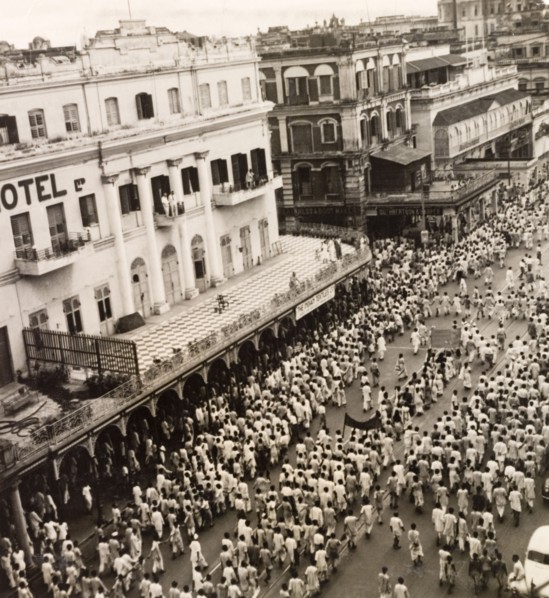 Protest on Old Court House Street, Calcutta, 1946. A crowd of Indian protesters brandish banners as