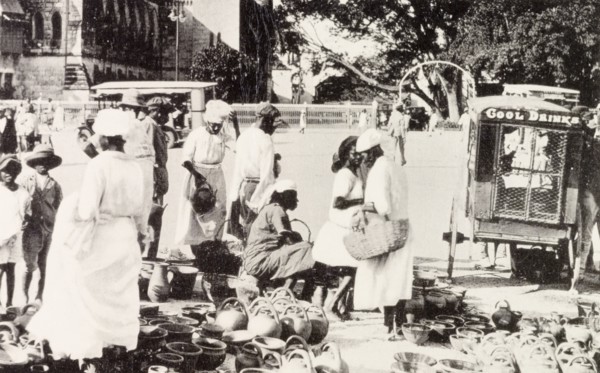 Roadside market, Barbados. Street traders sell pots and jugs at a roadside market stall in