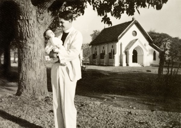 Methodist missionary cradling his daughter. Methodist missionary Reverend Norman Sargant cradles