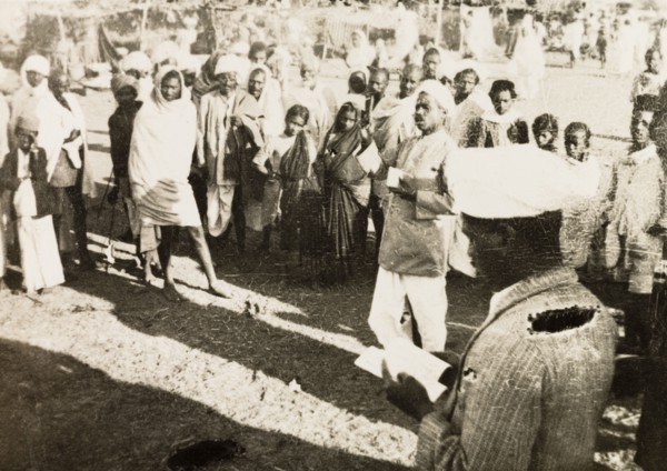 Evangelist preaching to villagers. Methodist evangelist R. Christadas preaches to a gathered crowd
