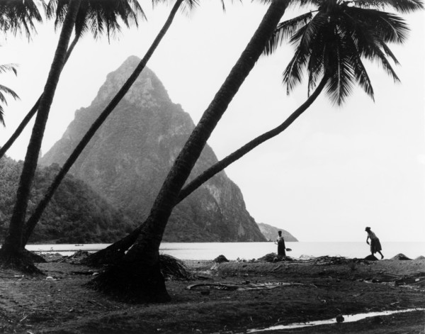 The Pitons, St Lucia. One of the Pitons rises up from the coastline of St Lucia, behind a beach of