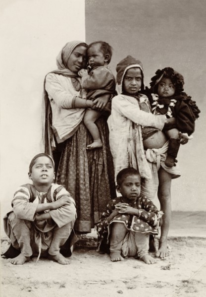 Child beggars, India. Portrait of a group of six children, including two infants, begging on the