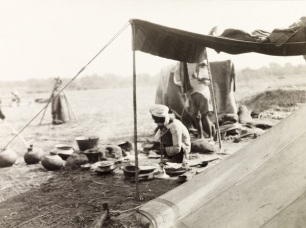 Mahouts camp at Coronation Durbar, 1903. Off-duty mahouts (elephant handlers) relax and cook
