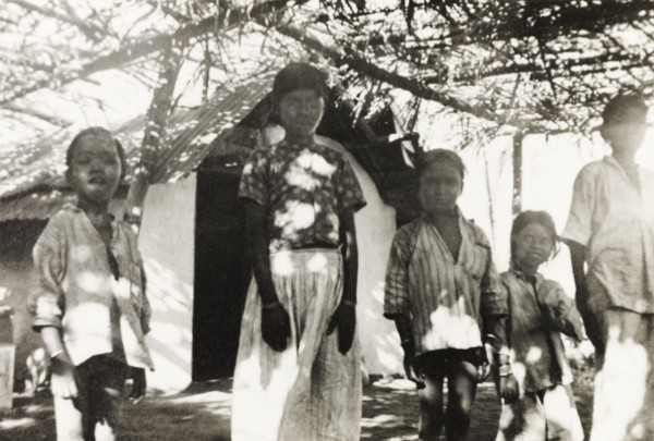 Mission school at 'Maskal Maradi' coffee estate. Children stand under a covered courtyard outside