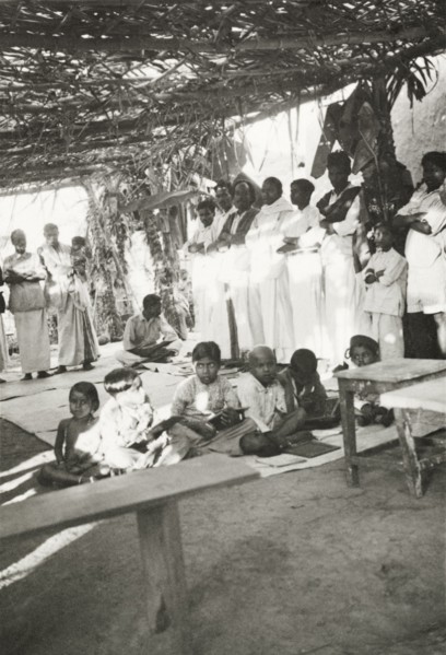 Night school at 'Maskal Maradi' estate. Children attend a night school class at a Methodist mission
