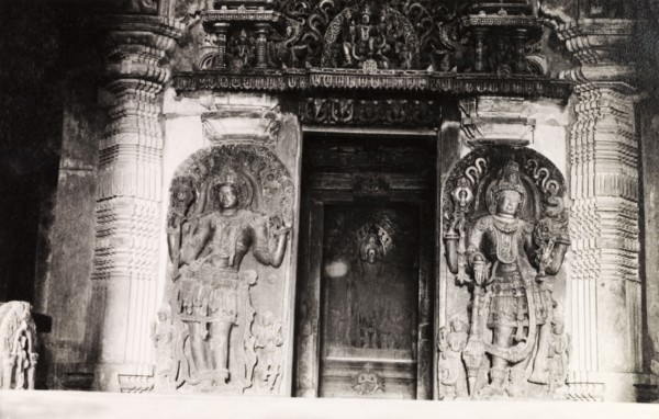 Sculptures at Chennakesava Temple. Two ornately sculpted 'doorkeepers' flank an image of Kesava