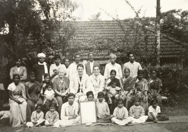 Reverend and congregation at Indian plantation. British missionary Reverend Norman Sargant (centre)