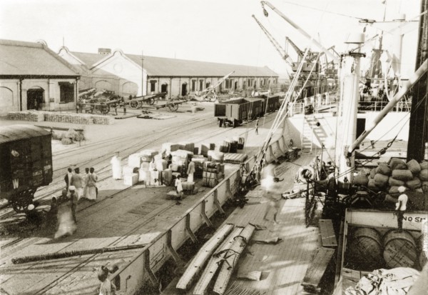 A cargo of Italian war supplies at Suez. Italian war supplies are loaded onto a ship, ready to be