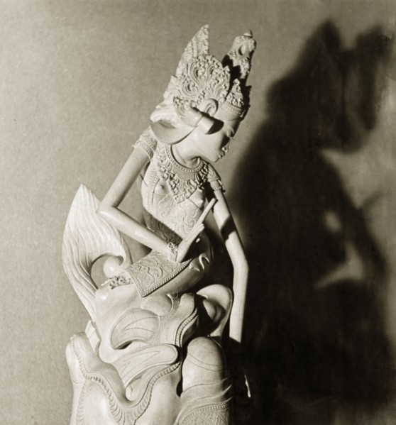 A Hindu figurine from Bali. A intricately carved figurine of a Hindu deity or 'devi' (goddess).