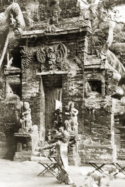 A traditional Balinese dance. A Balinese woman dressed in an elaborate costume performs a