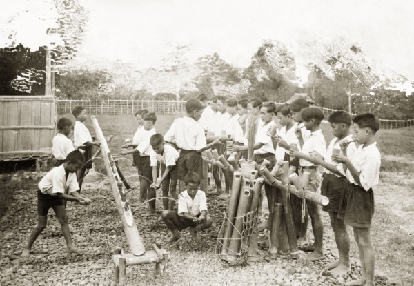 Schoolchildren washing at Keningau Health Centre. Schoolchildren wash their hands and clean their