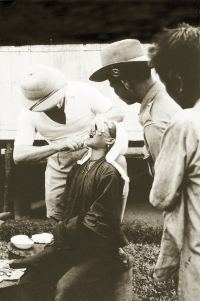 Dental treatment at Keningau Health Centre. A woman recieves dental treatment from a trainee at