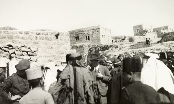 Tax collection in Idna. A British government official collects taxes in the Arab village of Idna.
