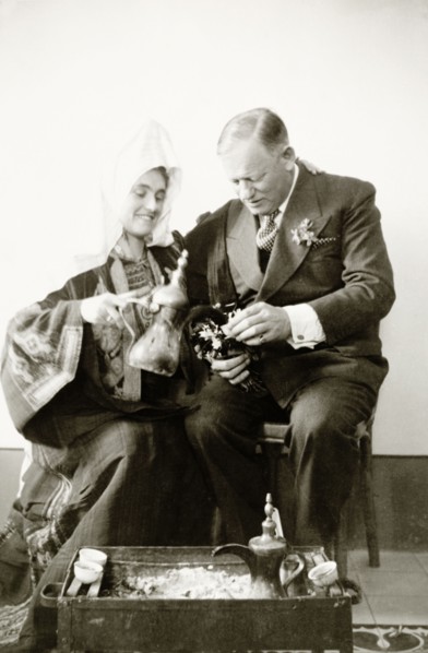Portrait of Mr and Mrs Keith-Roach . Edward Keith-Roach, District Governor of Jerusalem, holds out